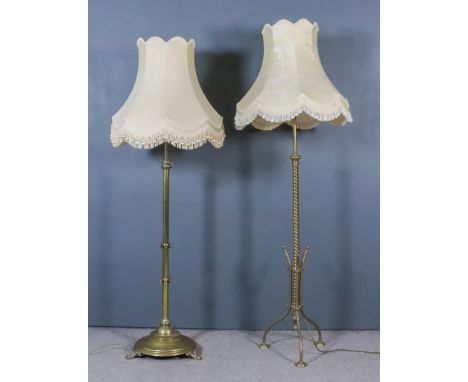 Two Late Victorian Brass Standard Lamps, (converted to electric), with shades for same, and a brass table oil lamp with pink 