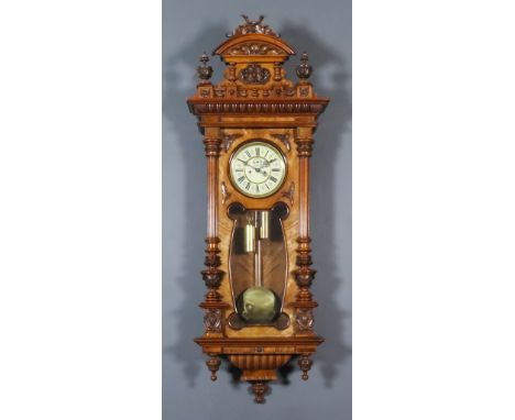 A Late 19th Century Continental Walnut Cased "Vienna Regulator", the 7ins diameter cream enamel dial with Roman numerals and 