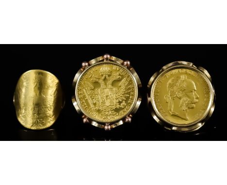 Two Austrian 1915 Ten Corona Gold Coins, in gold coloured metal ring mounts, and one other Austrian Ten Corona coin formed in