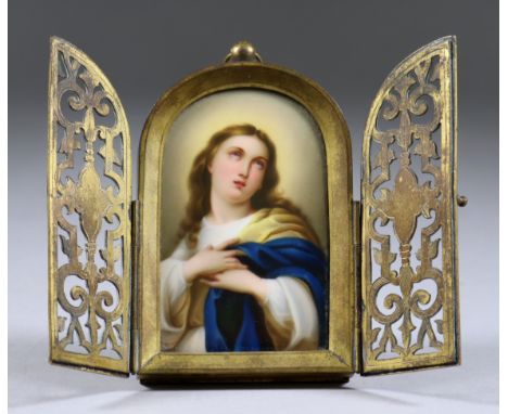 A French Porcelain Plaque Enamelled with "The Penitent Magdalene", Late 19th Century, mounted in an English gilt brass frame 