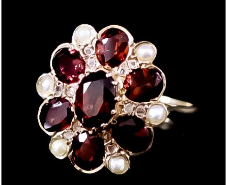 A Seed Pearl and Red Stone Flower Head Pattern Ring, Modern, in 9ct gold mount, set with five faceted paste red stones and si