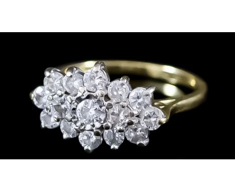 A Diamond Cluster Ring, 20th Century, in 18ct gold mount, set with fourteen round brilliant cut white diamonds, approximate d