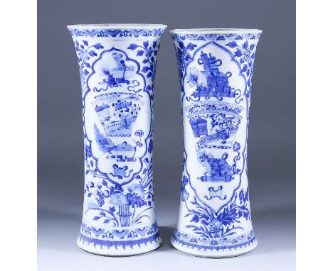 Two Chinese Blue and White Porcelain Sleeve Vases, painted with objects within shaped reserve panels, and flowering branches,