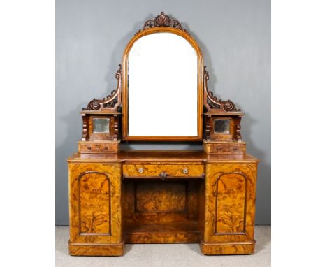 A Victorian Figured Walnut Kneehole Dressing Table and a Similar Wash Stand, the kneehole dressing table with central arched 