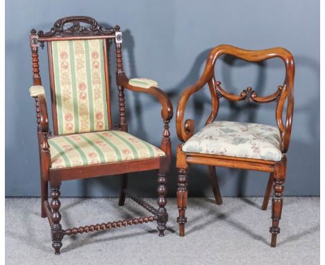 A Victorian Mahogany Armchair and a Victorian Mahogany Kidney Shaped Back Armchair, the armchair with crest rail fretted and 