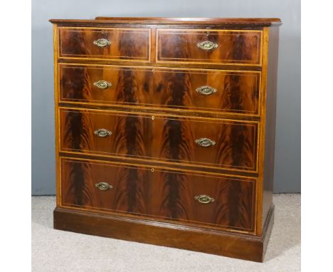 An Edwardian Mahogany Chest, with narrow moulded edge, the top and drawer fronts crossbanded in rosewood, fitted two short an