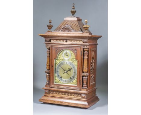 A Late 19th Century German Oak Cased Mantel Clock, by Winterhalder &amp; Hofmeier, the brass dial with 5.5ins diameter narrow