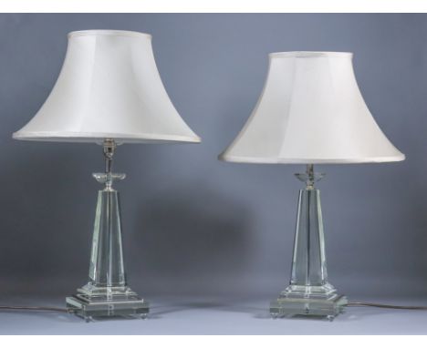 A Pair of Moulded and Polished Clear Glass Electric Table Lamps, of pyramidal form, on stepped square bases, 17.5ins high, an