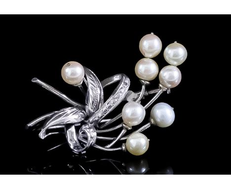 A Pearl Spray Brooch, 20th Century, in 14ct white gold mount, set with eight cultured pearls, each approximately 6mm diameter