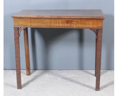 A Mahogany Rectangular Hall Table of "Chinese Chippendale" Design, with moulded edge to top, plain frieze, on square legs wit