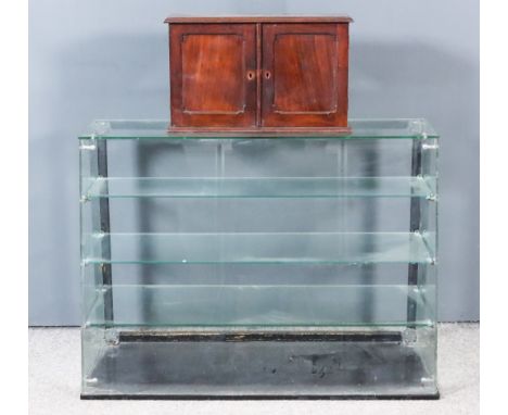 A Plate Glass Shop Counter Display Cabinet, with angled front, fitted three plate glass shelves, 36ins wide x 15ins deep x 26