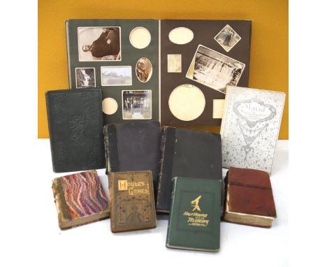 Various photo albums and vintage books,. See photos. 