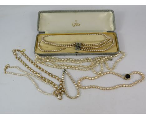 Selection of vintage and modern faux pearl necklaces and a bracelet.