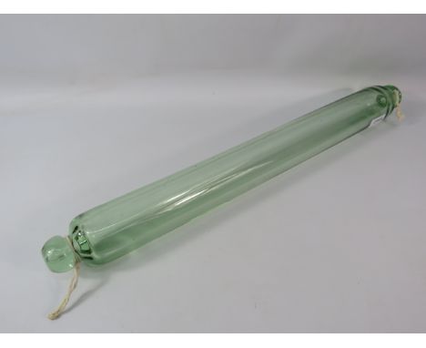 Antique long pale green glass rolling pin. 23 3/4" long.