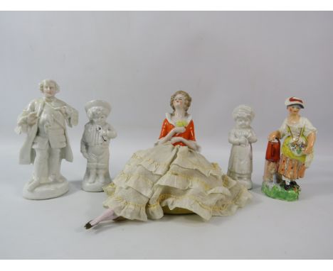 Vintage porcelain pin cushion doll and 4 vintage continental figurines ( 2 have repairs)