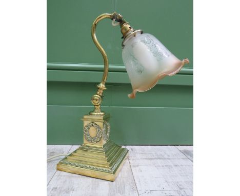 Lovely Ornate Brass Bodied table lamp with frosted glass shade fading to amber edge. Adustable base and neck. Excellent condi