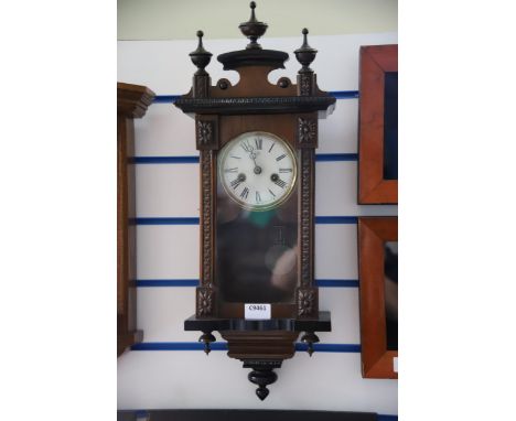 Vintage wall clock belived to be in working order.  23 inches long.   See photos. 