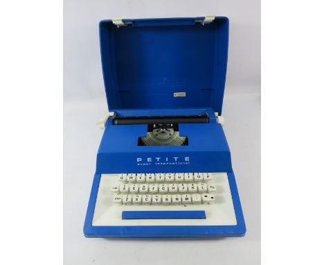 Petite Super international vintage travel type writer.