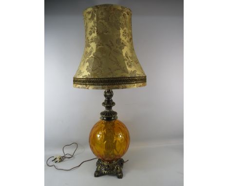 Large Table lamp with amber glass body and gold shade, 35.5" from base to top of the shade.
