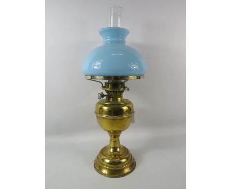 Vintage Duplex brass oil lamp with baby blue glass shade, 20.5" tall.