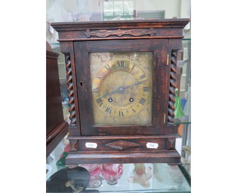 French made Mantle clock with carved oak case and Brass dial. Runs well with key and pendulum. Measures approx 12 inches all.