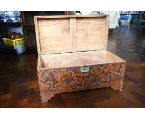 Deeply Carved Camphorwood Chest llwith lifing lid. Raised on Bracket feet it measures H:15 x W:29 x D:14 Inches. See photos. 