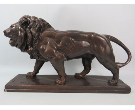 Large and Heavy Bronze effect Vintage Lion with the impressed signature 'Barye', Measures approx 9.5 inches tall by 15 inches