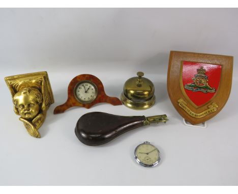 Mixed collectables to include a leather gun powder flask, Bakelite clock, brass counter bell etc.