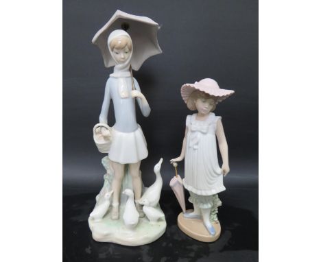 Lladro Figurine 'Girl with parasol feeding Geese approx 11 inches tall plus a Nao Girl with Parasol, 7.5 inches tall. See pho