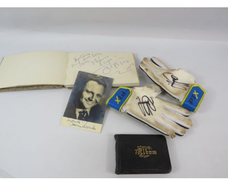 Mixed lot to include a pair of signed childrens goal keeper gloves, a momento book and a Autograph book with signatures from 