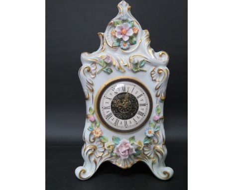 Very pretty Capodimonte Porcelain small mantle clock with mechanical movement in working order. Decorated with porcelain flow