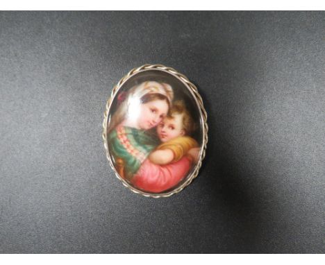 An antique painted portrait brooch 