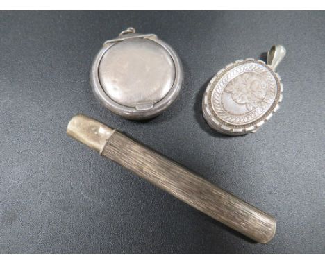 A hallmarked silver carpenters pencil holder and patch case together with a white metal victorian locket with engraved decora