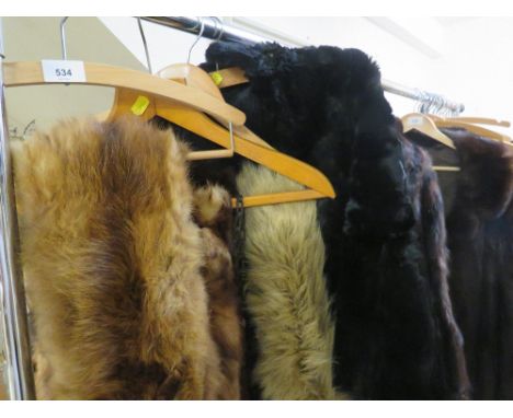 A vintage black fur cape together with a selection of fur stoles and vintage fur coat 