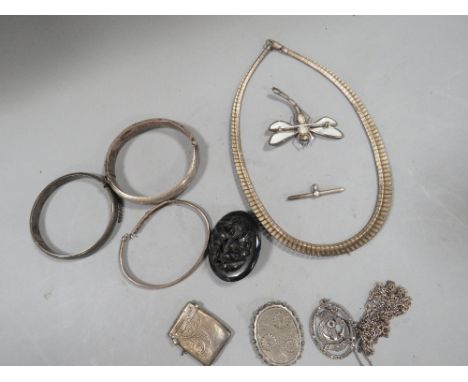 A collection of silver jewellery etc. to include clasp bangle, vesta case etc 