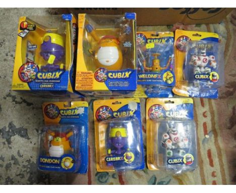A tray of assorted packaged Cubix figures 