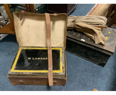 A vintage leather cased tin trunk named M Lambart together with another tin trunk, etc. 