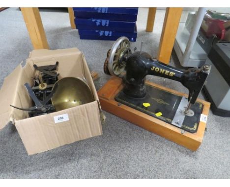 A vintage Jones' sewing machine together with a modern set of scales 