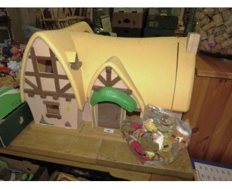 A vintage Disney Snow White and the Seven Dwarfs cottage with figures and furniture 