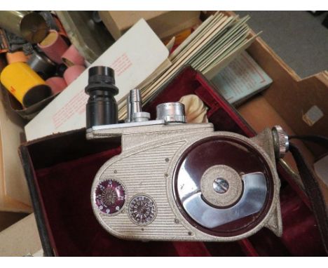 A tray of vintage photographic items to include a cased Bell &amp; Howell cine camera 