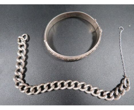 A hallmarked silver chain, together with a hallmarked silver bangle 