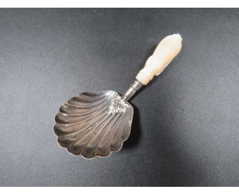 An antique silver caddy spoon 