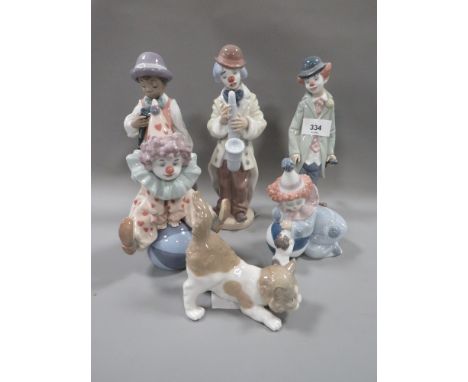 Six Lladro figures to include a boy and his clarinet 
