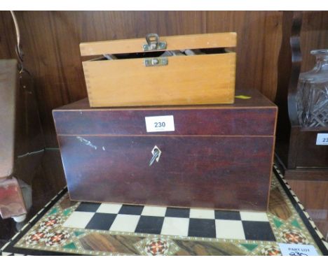 A vintage tea caddy together with a modern chess board and pieces 