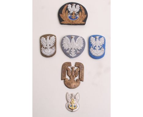 Collection of Polish Army, Navy and Air Force Insignia, including officers bullion cap badges, metal cap badges, paratrooper 
