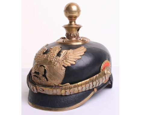 Imperial German Baden Artillery Officers Pickelhaube of black leather skull with scaled officers chinstrap and officers patte