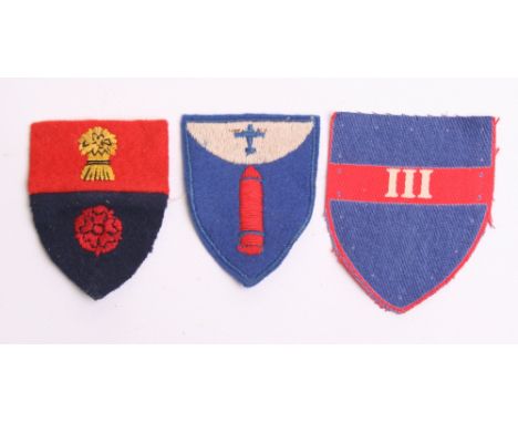Three Army Group Royal Artillery (AGRA) Formation Signs consisting of printed 3rd, embroidered 94th and embroidered 95th. All
