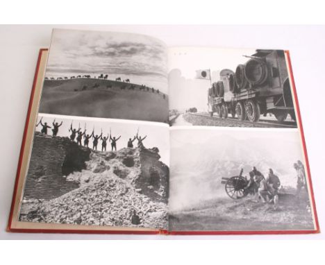 WW2 Japanese Army Propaganda Book showing black and white photographs of Japanese soldiers training in the field and victorie