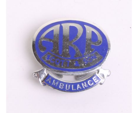 WW2 Home Front ARP Scott & Son Lapel Badge of chrome and blue enamel. Bottom of the badge has a scroll with Ambulance. Revers