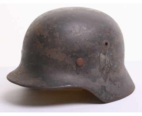 German Army Single Decal Combat Helmet complete with much of the original paint finish to the exterior of the shell. Approxim